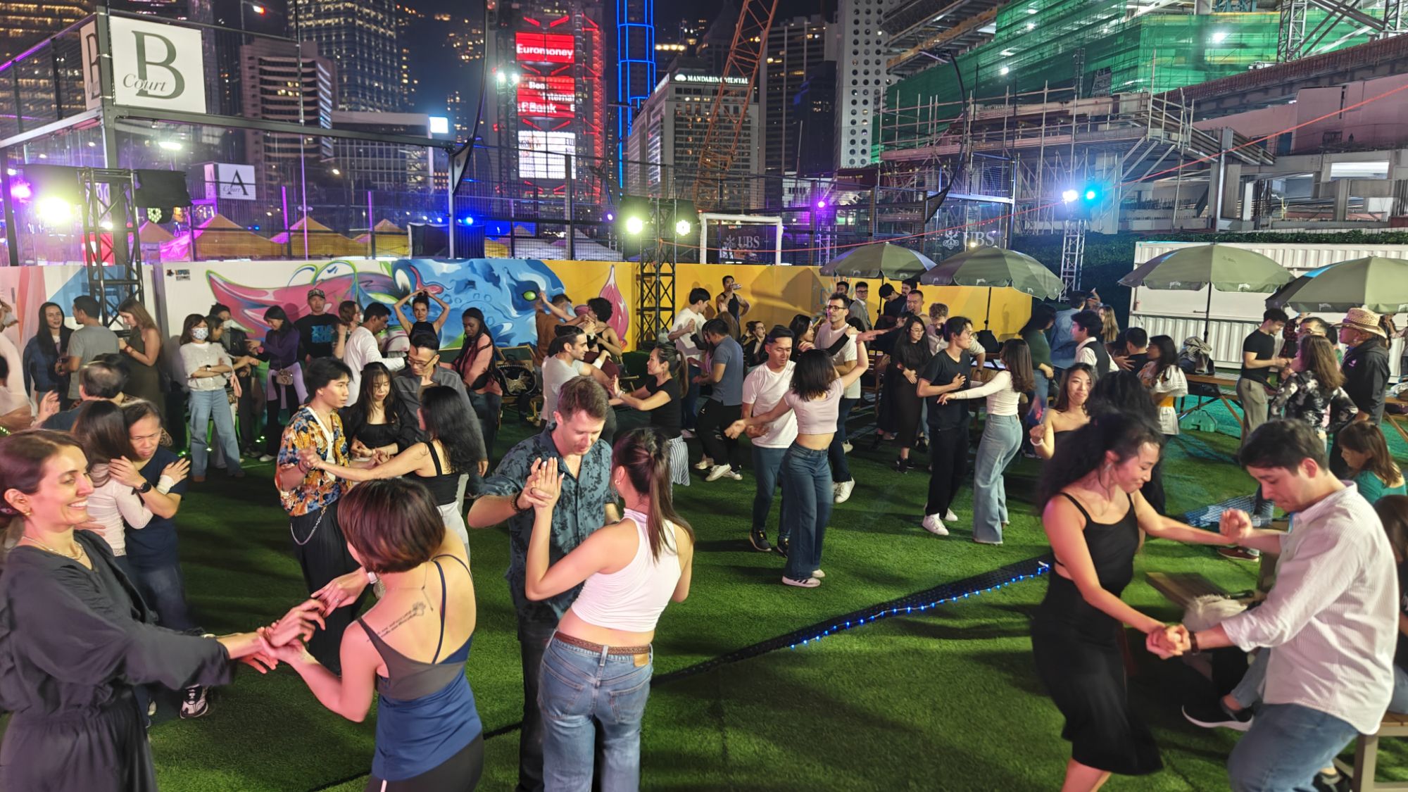 Bachata social dancers under the Kwun Tong outdoor floor